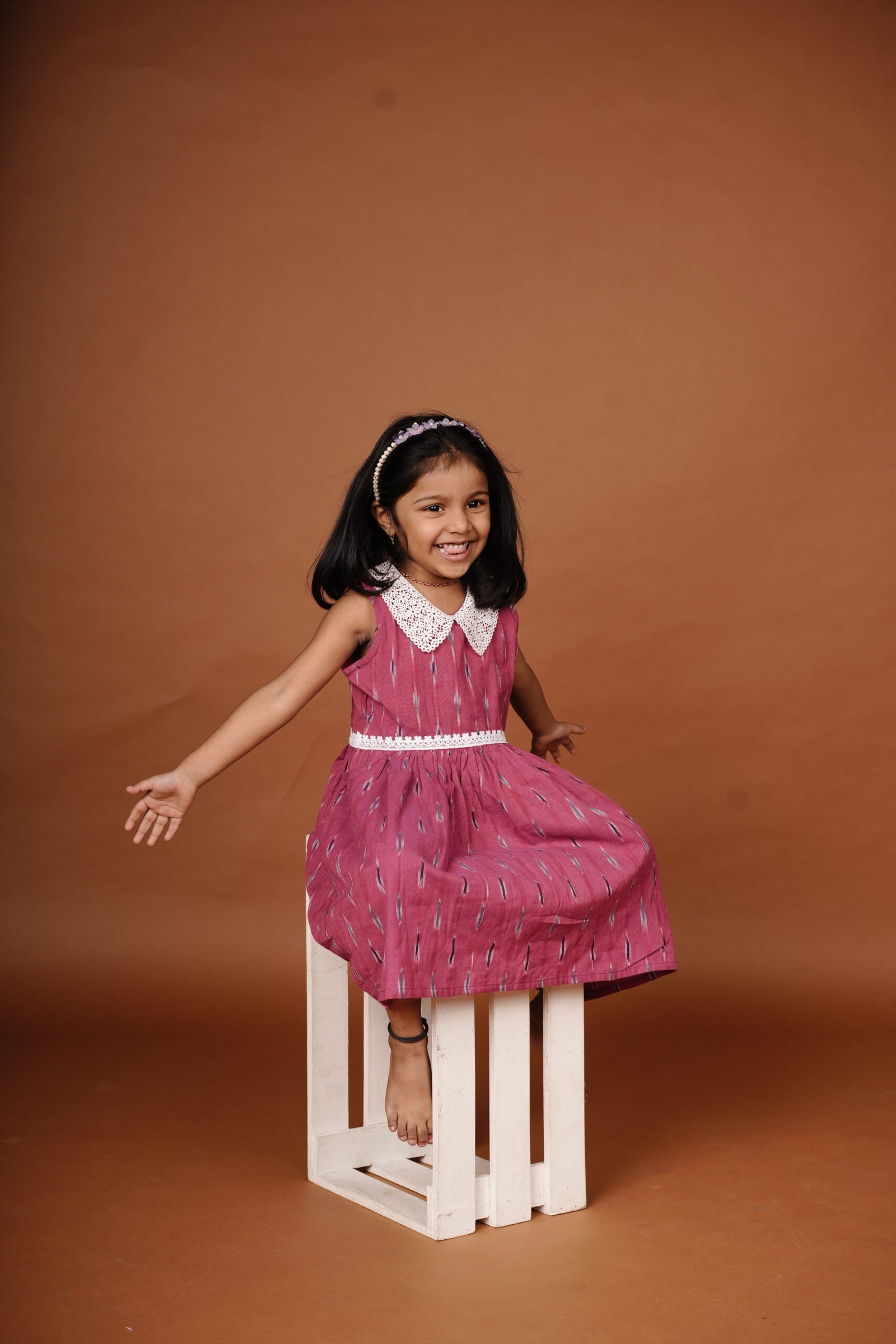 Ikkat-fabric-frock playing model